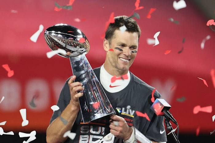Feb 7, 2021; Tampa, FL, USA; Tampa Bay Buccaneers quarterback Tom Brady (12) hoists the Vince Lombardi Trophy after defeating the Kansas City Chiefs in Super Bowl LV at Raymond James Stadium. Mandatory Credit: Matthew Emmons-USA TODAY Sports